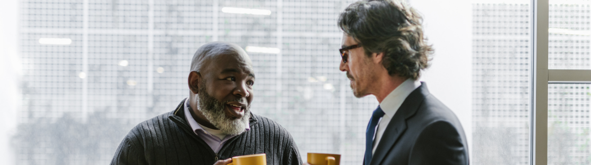 men talking over coffee