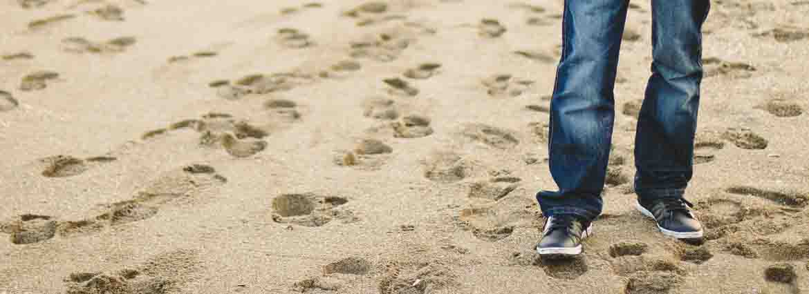 man walking on sand