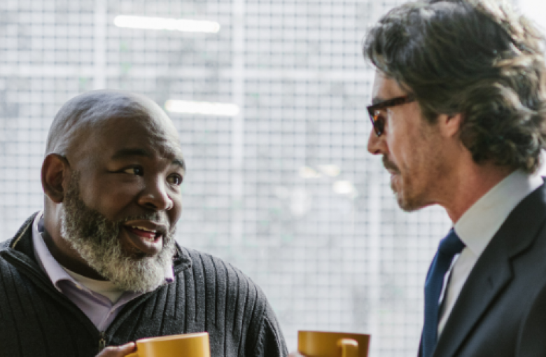 men talking over coffee